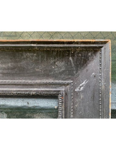 Antique cast iron insert designed to reduce the opening of a marble fireplace mantel.
