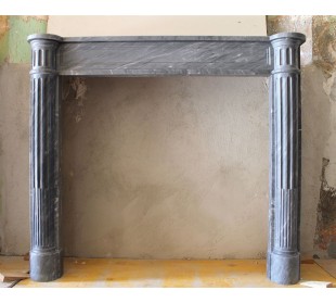 Antique Louis XVI fireplace mantel carved in Grey marble with the sculpture of two fluted columns