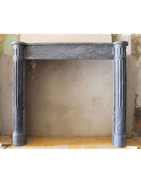 Antique Louis XVI fireplace mantel carved in Grey marble with the sculpture of two fluted columns