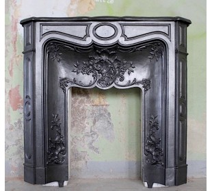Antique fireplace mantel made of artistic cast iron, refined and elegant. This is an alternative to marble fireplaces.