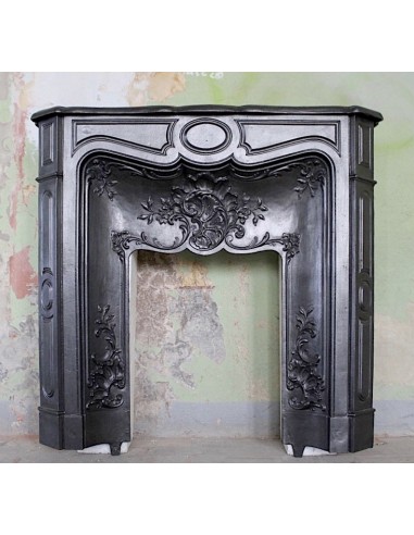 Antique fireplace mantel made of artistic cast iron, refined and elegant. This is an alternative to marble fireplaces.