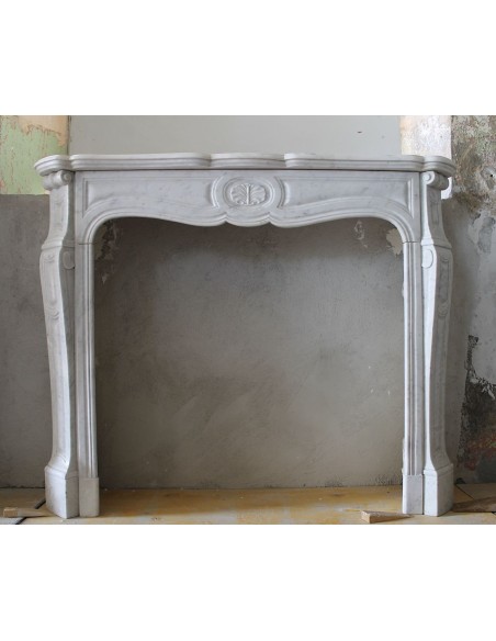 Antique original Louis XV fire surround carved in white Carrara marble. An exceptional specimen of Floral Galbé marble fireplace