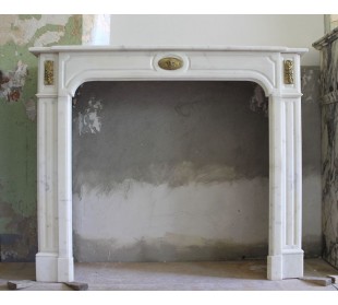 Original Louis XIV fire surround in white Statuary marble with refined decorated bronzes.