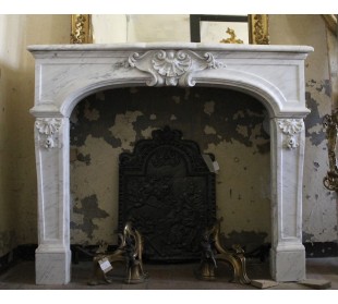 Rare Louis XIV fireplace mantel carved in white Carrara marble. This fire surround has floral decorations all over its surfaces.