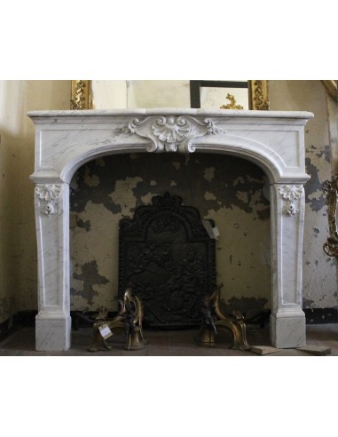 Rare Louis XIV fireplace mantel carved in white Carrara marble. This fire surround has floral decorations all over its surfaces.