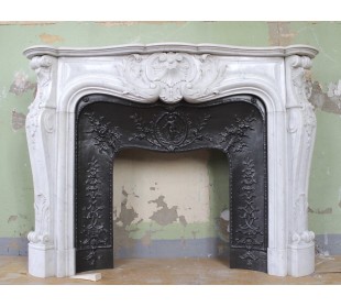 Antique Louis XV "Rosaces" fireplace mantel carved in white Carrara marble with its own original cast iron insert.