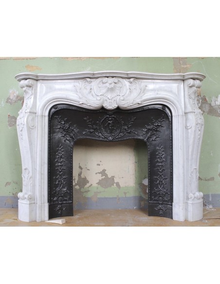 Antique Louis XV "Rosaces" fireplace mantel carved in white Carrara marble with its own original cast iron insert.