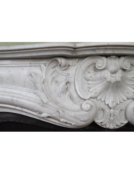 027 AG ANTIQUE LOUIS XV "ROSACES" FIREPLACE MANTEL CARVED IN WHITE CARRARA MARBLE WITH ITS OWN ORIGINAL FLORAL CAST IRON INSERT