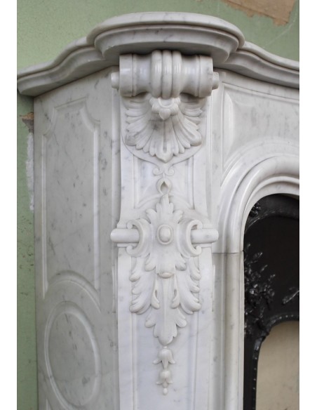 027 AG ANTIQUE LOUIS XV "ROSACES" FIREPLACE MANTEL CARVED IN WHITE CARRARA MARBLE WITH ITS OWN ORIGINAL FLORAL CAST IRON INSERT