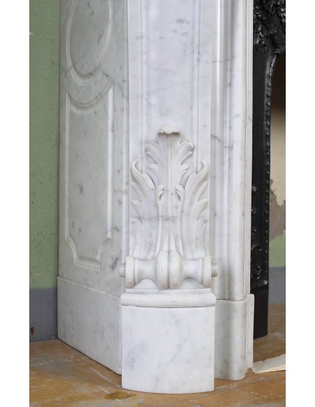 027 AG ANTIQUE LOUIS XV "ROSACES" FIREPLACE MANTEL CARVED IN WHITE CARRARA MARBLE WITH ITS OWN ORIGINAL FLORAL CAST IRON INSERT