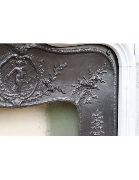 027 AG ANTIQUE LOUIS XV "ROSACES" FIREPLACE MANTEL CARVED IN WHITE CARRARA MARBLE WITH ITS OWN ORIGINAL FLORAL CAST IRON INSERT