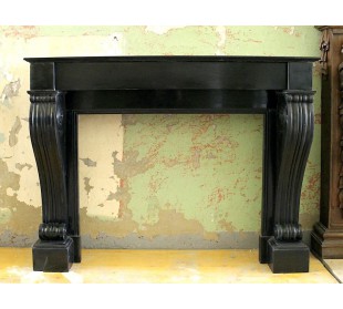 Antique Louis Philippe "Rouleau" fireplace mantel carved in black Belgium marble dating back to the 19th century.