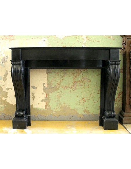 Antique Louis Philippe "Rouleau" fireplace mantel carved in black Belgium marble dating back to the 19th century.