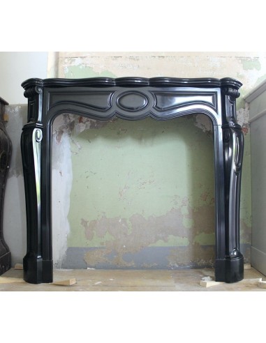 Antique Louis XV "Pied Galbé" fireplace mantel sculpted out of Black Belgian marble.