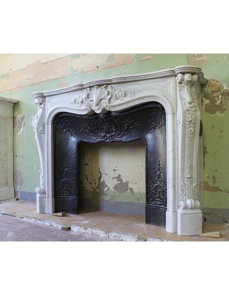 021 AG ANTIQUE LOUIS XV "DAUPHIN" MANTEL CARVED IN WHITE CARRARA MARBLE WITH ITS OWN ORIGINAL CAST IRON INSERT