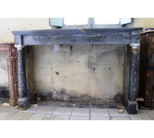 Antique Empire-style fireplace mantel in blue marble. This antique fire surround has two columns.