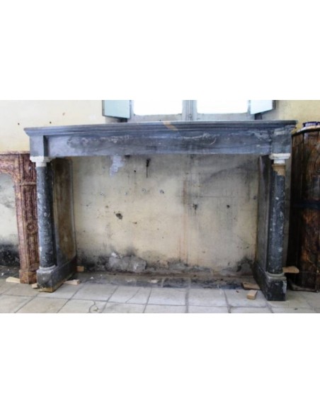 Antique Empire-style fireplace mantel in blue marble. This antique fire surround has two columns.