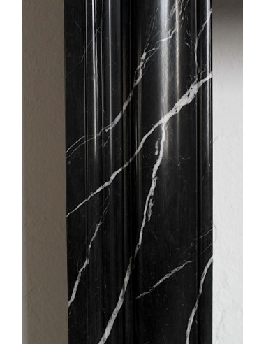 Antique Bolection mantelpiece carved in Black Marquinia marble. This fireplace comes from Paris and it is a truly unique piece.