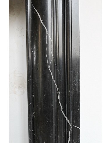 Antique Bolection mantelpiece carved in Black Marquinia marble. This fireplace comes from Paris and it is a truly unique piece.