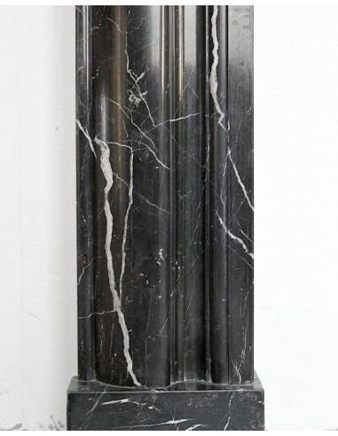 Antique Bolection mantelpiece carved in Black Marquinia marble. This fireplace comes from Paris and it is a truly unique piece.