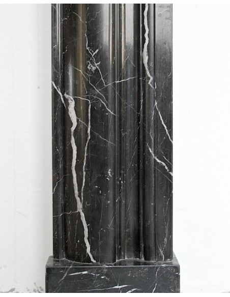 Antique Bolection mantelpiece carved in Black Marquinia marble. This fireplace comes from Paris and it is a truly unique piece.
