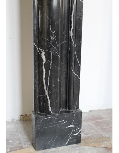Antique Bolection mantelpiece carved in Black Marquinia marble. This fireplace comes from Paris and it is a truly unique piece.