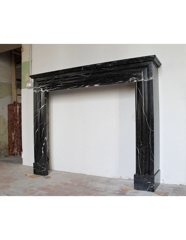 Antique Bolection mantelpiece carved in Black Marquinia marble. This fireplace comes from Paris and it is a truly unique piece.