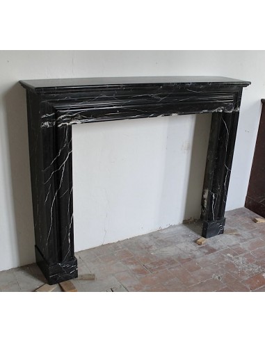 Antique Bolection mantelpiece carved in Black Marquinia marble. This fireplace comes from Paris and it is a truly unique piece.