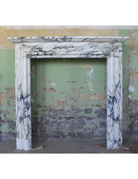 Antique “Boudin” fireplace mantel carved in Breccia Medicea marble and very large in size.