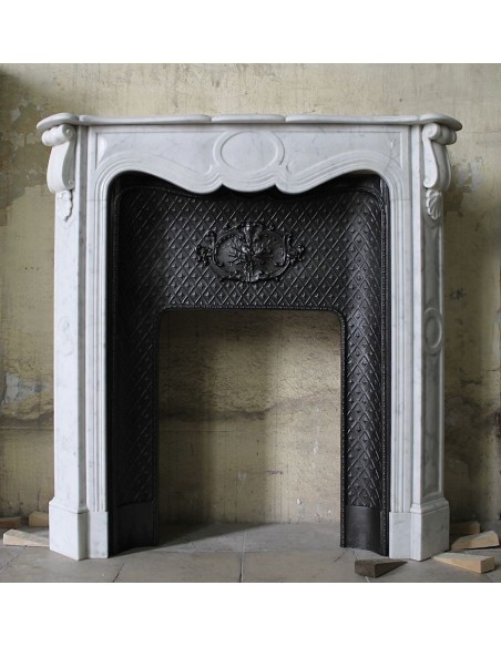 Antique white marble fireplace mantel with its own original cast iron insert.