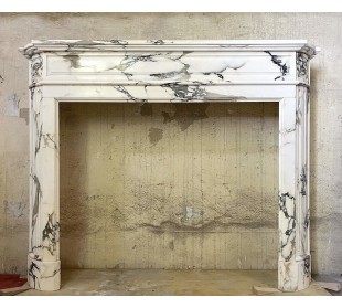 Antique Art Deco fireplace surround carved in fine Breccia Medicea marble.