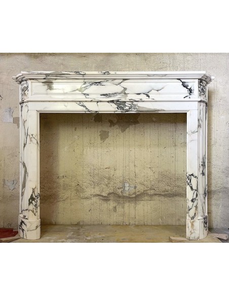 Antique Art Deco fireplace surround carved in fine Breccia Medicea marble.