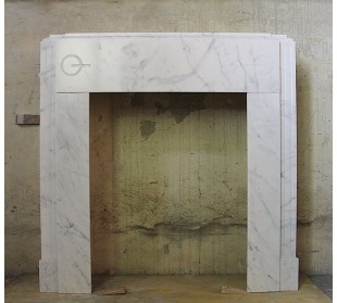 Antique Art Deco fireplace surround in white marble with contrasting veining.