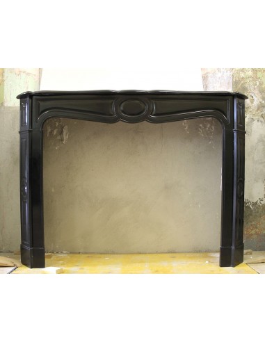Antique marble fireplace mantle carved in black Belgium marble. This fire surround belongs to the Pompadour family.