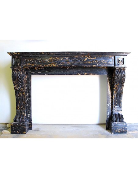 Exceptional "Griffe de Lion" fireplace carved in Portoro Gold marble. This is one of the rarest antique fireplaces.