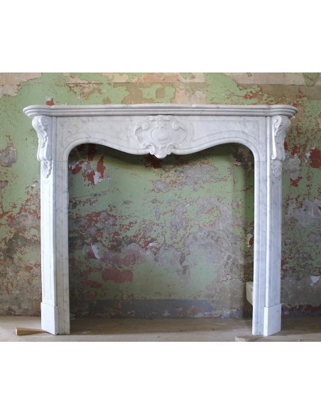 Antique Art Nouveau marble fireplace carved in white Carrara marble.