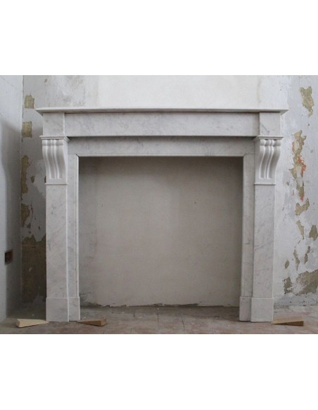 Antique and original white Carrara "Modillon" marble fireplace mantel carved in the 19th century and coming from Paris.