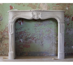 Antique fireplace mantel from Paris carved in beige stone