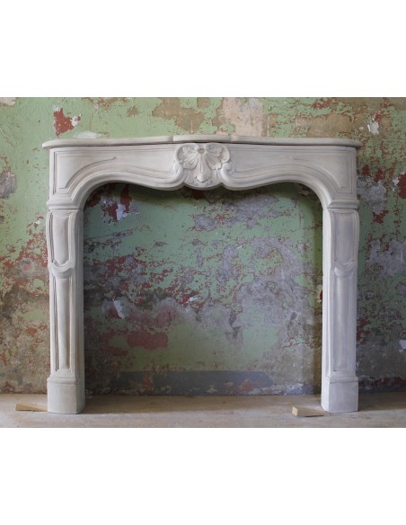Antique fireplace mantel from Paris carved in beige stone