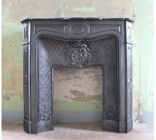 Antique Art Nouveau cast iron fireplace mantel dating back to the 19th century.