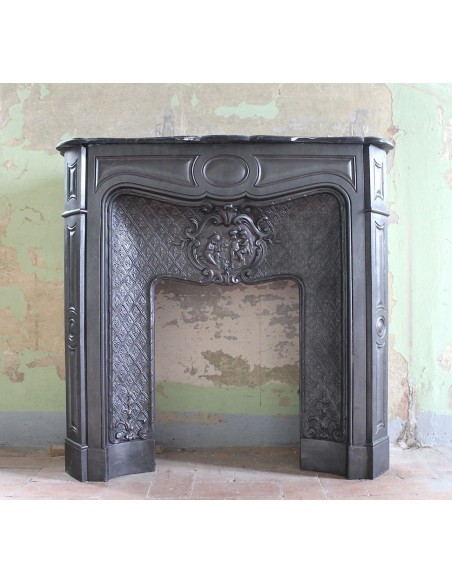 Antique Art Nouveau cast iron fireplace mantel dating back to the 19th century.