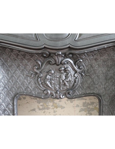 004GH ANTIQUE LARCHER "LES TROIS BÉBÉS" CAST-IRON FIREPLACE MANTEL WITH BLACK MARQUINIA MARBLE TABLET