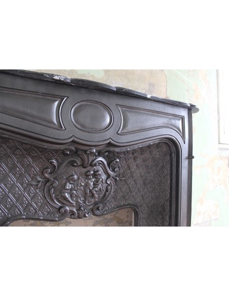 004GH ANTIQUE LARCHER "LES TROIS BÉBÉS" CAST-IRON FIREPLACE MANTEL WITH BLACK MARQUINIA MARBLE TABLET
