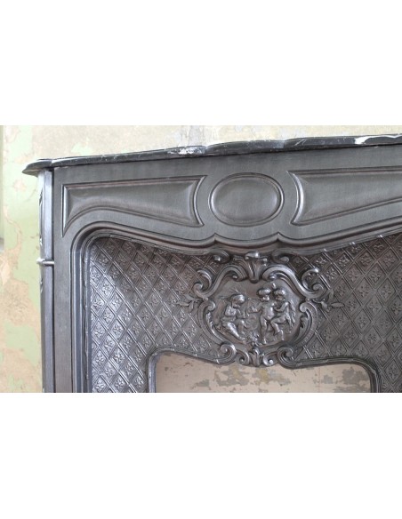 004GH ANTIQUE LARCHER "LES TROIS BÉBÉS" CAST-IRON FIREPLACE MANTEL WITH BLACK MARQUINIA MARBLE TABLET