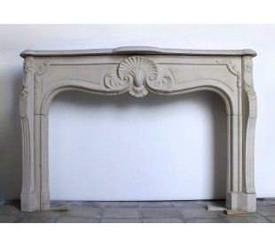 Antique French baroque-style mantel carved in Pierre Dorée stone.