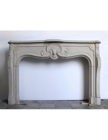 Antique French baroque-style mantel carved in Pierre Dorée stone.