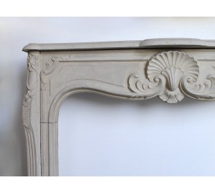 Antique French baroque-style mantel carved in Pierre Dorée stone. 2