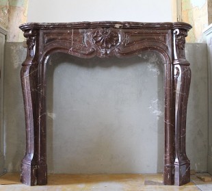 ORIGINAL LOUIS XV "TROIS COQUILLES" FIREPLACE SURROUND CARVED IN ROUGE ROYAL VERSAILLES MARBLE