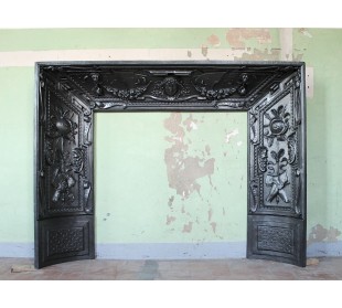 Cast iron fireplace insert that can be used as a marble mantel or as a stand-alone antique fireplace.