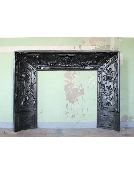 Cast iron fireplace insert that can be used as a marble mantel or as a stand-alone antique fireplace.
